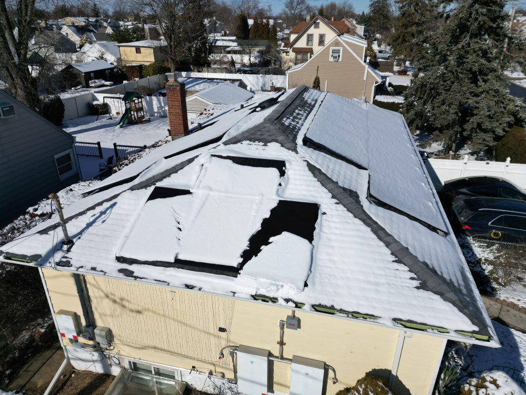 Photos of the solar panels covered in snow (around 1 PM local time).